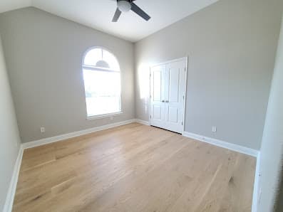 Freshly updated bedroom with new flooring and paint